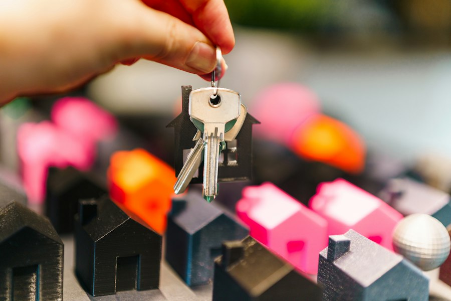 Hand holding house keys